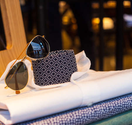 View of men's shirts, necktie and shadesの写真素材