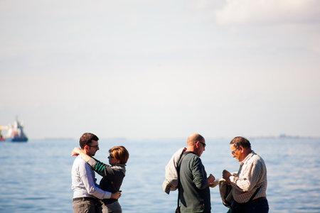 TRIESTE, ITALY - OCTOBER, 10: Couple of lovers and friends next to the Trieste sea on October 10, 2013のeditorial素材