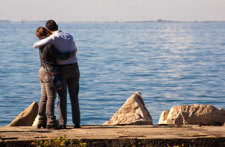Couple of lovers next to the Trieste seaの写真素材