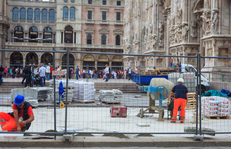 MILAN, ITALY - MAY 26: Bricklayers in the construction site next to the Milan cathedral on May 26, 2014のeditorial素材