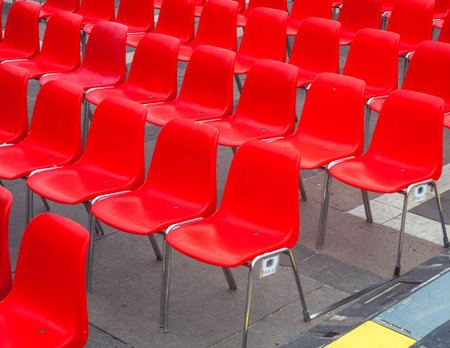 many red chairs ready for conference