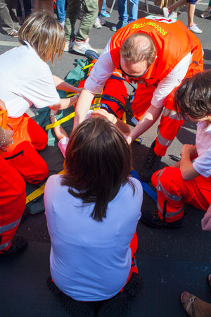 MILAN, ITALY - MAY, 18: Emergency personnel render aid to a girl during an emergency simulation on May 18, 2014のeditorial素材