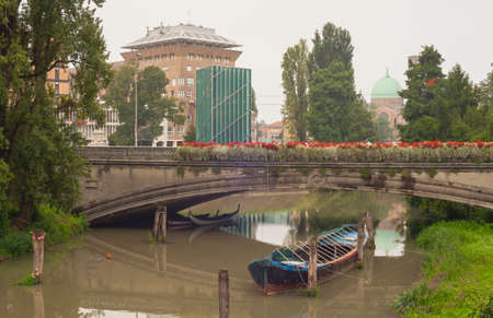 View of the boat under the bridge, Padovaの写真素材