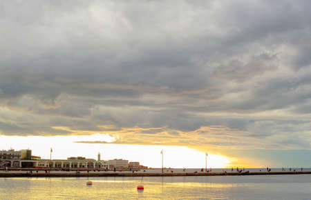 View of Trieste harbor at sunset, Italyの写真素材