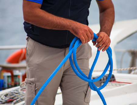 TRIESTE, ITALY - OCTOBER 12: The crew of sailboat haul down the sails During The 46th Barcolana regatta in Trieste sea on October 12, 2014のeditorial素材