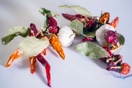 Close up of garlics, chili peppers, bay leavesの写真素材