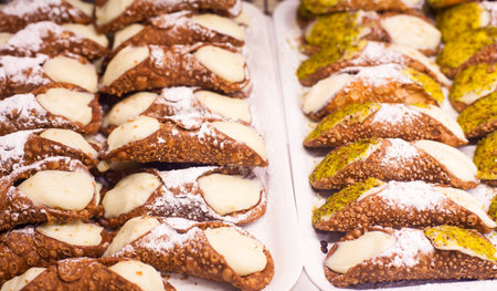 Close up of Cannoli siciliani, typical sicilian pastry with ricotta, soft white Italian cheese