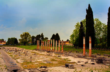 View of columns, Roman ruins on Archeological area of Aquileia in Italyの写真素材