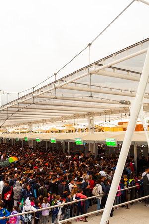 MILAN, ITALY - MAY, 20: People waiting access to Expo, universal exposition on the theme Feeding the planet, Energy for life on May 20, 2015 in Milanのeditorial素材