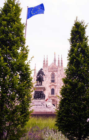 View of the Milan cathedral betwen treesの写真素材