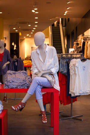 Close up of mannequin with female shirts exposed in the clothes shopの写真素材