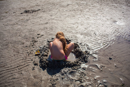 GRADO, ITALY - AUGUST, 29: Child playing on the beach on August 29, 2015のeditorial素材
