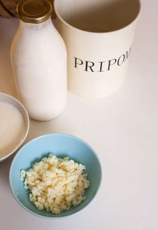 Organic probiotic milk kefir grains inside the bowlの写真素材
