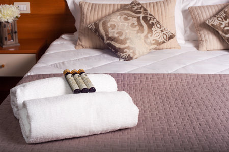 Towels and soap on bed of Ares hotelのeditorial素材