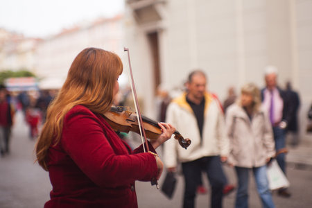 TRIESTE, ITALY - MAY, 14: Female violinist playing in the street on May 14, 2016のeditorial素材