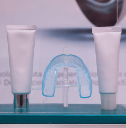 Close up of toothpaste and retainers for moving teeth
