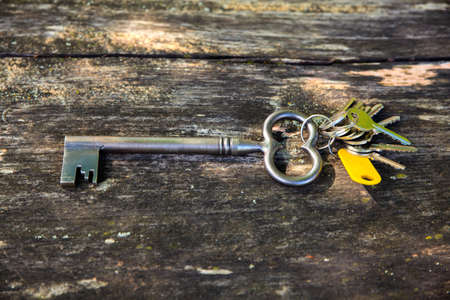 Old keys on wooden surfaceの写真素材