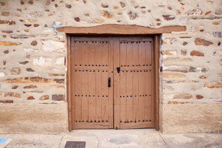 View of old door of rural house in the spanish townの写真素材