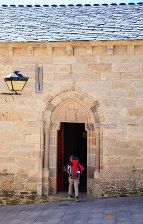 Pilgrimn go to the church O Salvador in Sarria, Spain