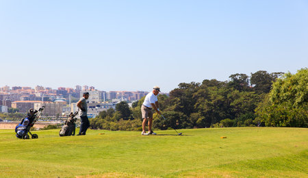 SANTANDER, SPAIN - AUGUST, 22: Man playing golf on August 22, 2016のeditorial素材