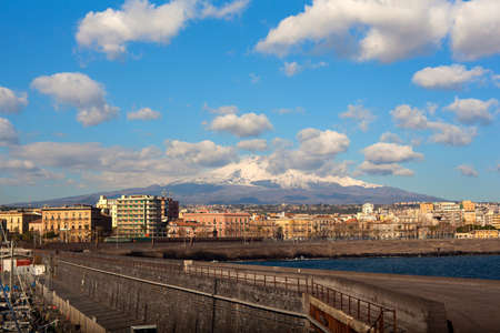 View of Catania from harbor, Etna volcano on background, Sicily. Italyの写真素材
