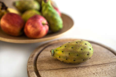 Delicious prickly pear on chopping boardの写真素材