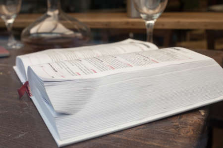 Open book guide of wine on the tableの写真素材