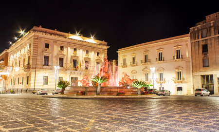 SIRACUSA, ITALY - DECEMBER, 31: The fountain on the square Archimedes in Syracuse. In the center of the fountain is a magnificent statue of Diana - hunter, surrounded by sirens and tritons on December 31, 2017のeditorial素材