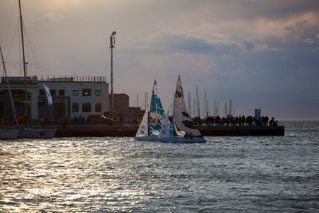 TRIESTE, ITALY - 06 OCTOBER 2017: Sailboats at sunset during the 49 Barcolana on 06 October, 2017のeditorial素材