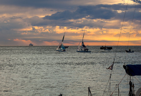 TRIESTE, ITALY - 06 OCTOBER 2017: Sailboats at sunset during the 49 Barcolana on 06 October, 2017のeditorial素材