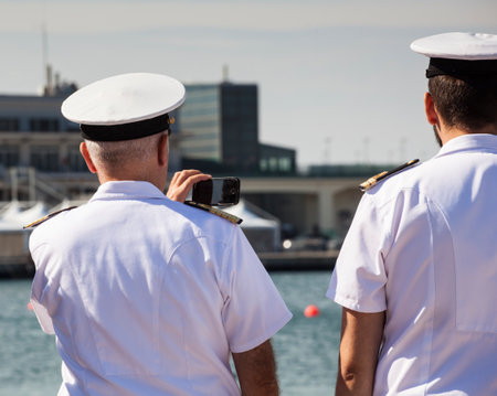 TRIESTE, ITALY - 06 OCTOBER 2017: Italian naval officers taken photos during the 49 Barcolana on 06 October, 2017のeditorial素材