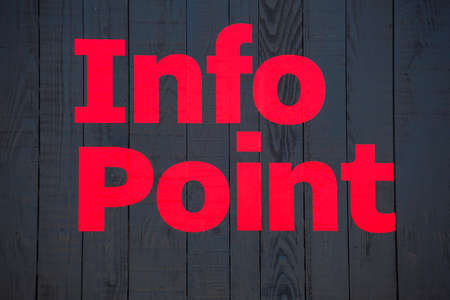 Red info point phrase on black wooden surfaceの写真素材