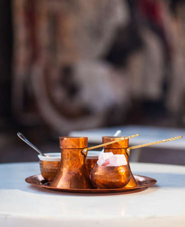 Traditional bosnian coffee served with traditional delights in a coffee house の写真素材