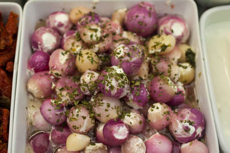 Delicious spring onions with parsley for sale on a market stallの写真素材