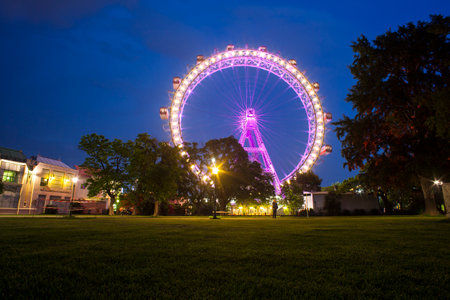 View of the Lighting Ferris wheel at night in famous Prater theme amusement Park of Viennaのeditorial素材