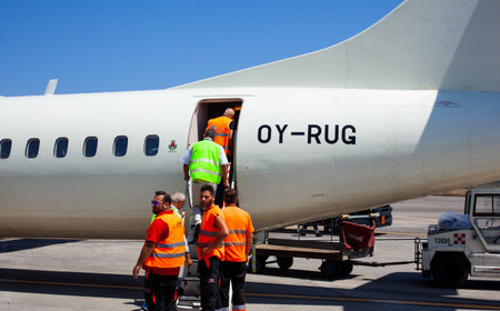 CATANIA AIRPORT, ITALY - AUGUST, 06: Airport workers controlling after the plane landed on August...