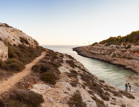 LAMPEDUSA, ITALY - JULY, 29: View of Cala Greca at sunset in the summer season on July 29, 2018のeditorial素材