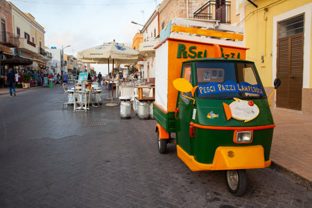 LAMPEDUSA, ITALY - JULY, 31: View of  traditional italian three-wheeled called Ape Piaggio used to selfresh fish in Lampedusa on July 31, 2018のeditorial素材