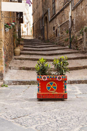 Decorated pot in the alley of Piazza Armerina, Sicily. Italyの写真素材