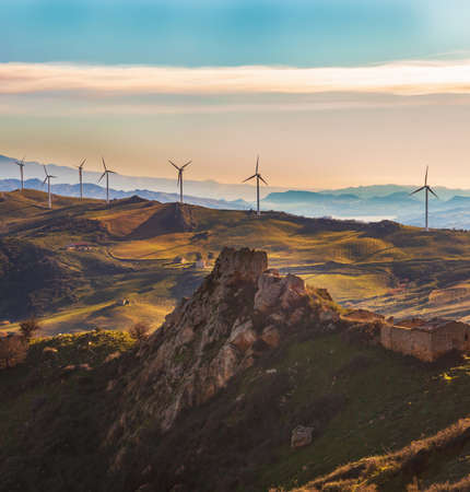 View of windmills in the Sicilian countryside, Enna territoryの写真素材