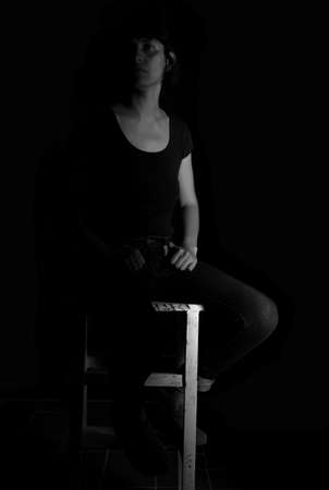 Dramatic portrait of an indian girl on black backgroundの写真素材