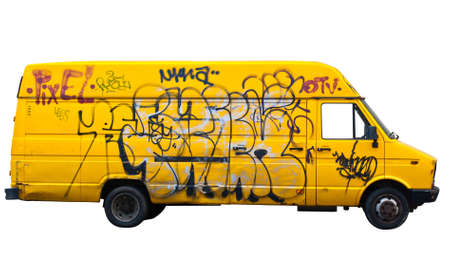 Yellow van covered in graffiti isolated on white backgroundの写真素材