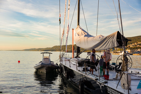 TRIESTE, ITALY - OCTOBER, 08: The crew of sailboat haul down the sails during the 52 Â° Barcolana regatta in Trieste sea on October 08, 2020のeditorial素材