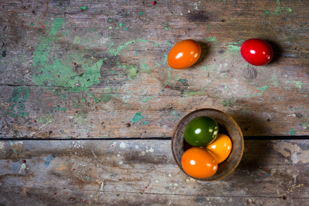 Colorful Easter eggs on wooden backgroundの写真素材