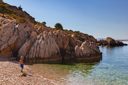 Stara Baska, Croatia - July, 21: Child in the Oprna beach on July 21, 2020のeditorial素材