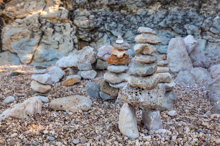 Stack of stones on the Stara Baska beach, Krk. Croatiaの写真素材
