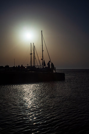 View of the pier of Linosa at sunset, Sicilyの写真素材