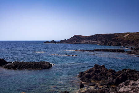 View of the scenic lava rock cliff in the Linosa island. Sicilyの写真素材