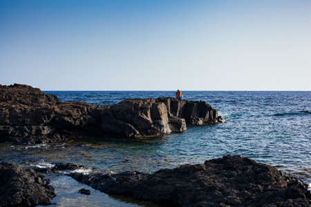 View of the scenic lava rock cliff in the Linosa island. Sicilyの写真素材