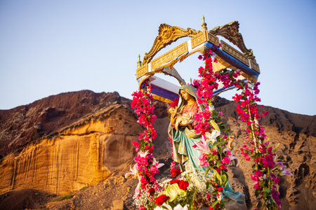 Linosa, Italy - July 25: Statue of the Madonna decorated with flowers at the Procession of the Stella Maris during the religious patronal feast of the Madonna of the sea on July 25, 2021のeditorial素材